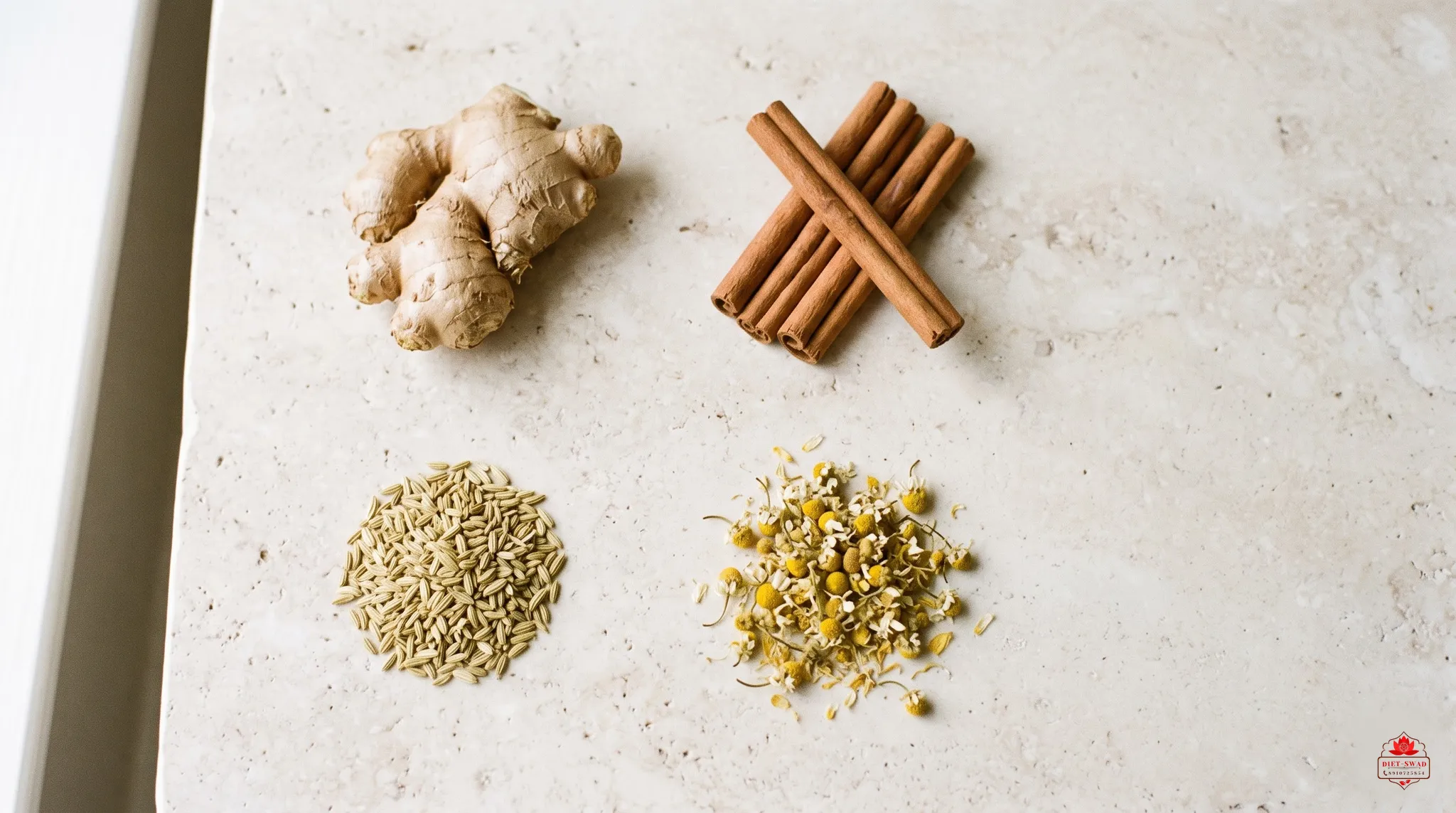 Ginger root, cinnamon sticks, fennel seeds and dried chamomile laid out in four separate groups on pale stone