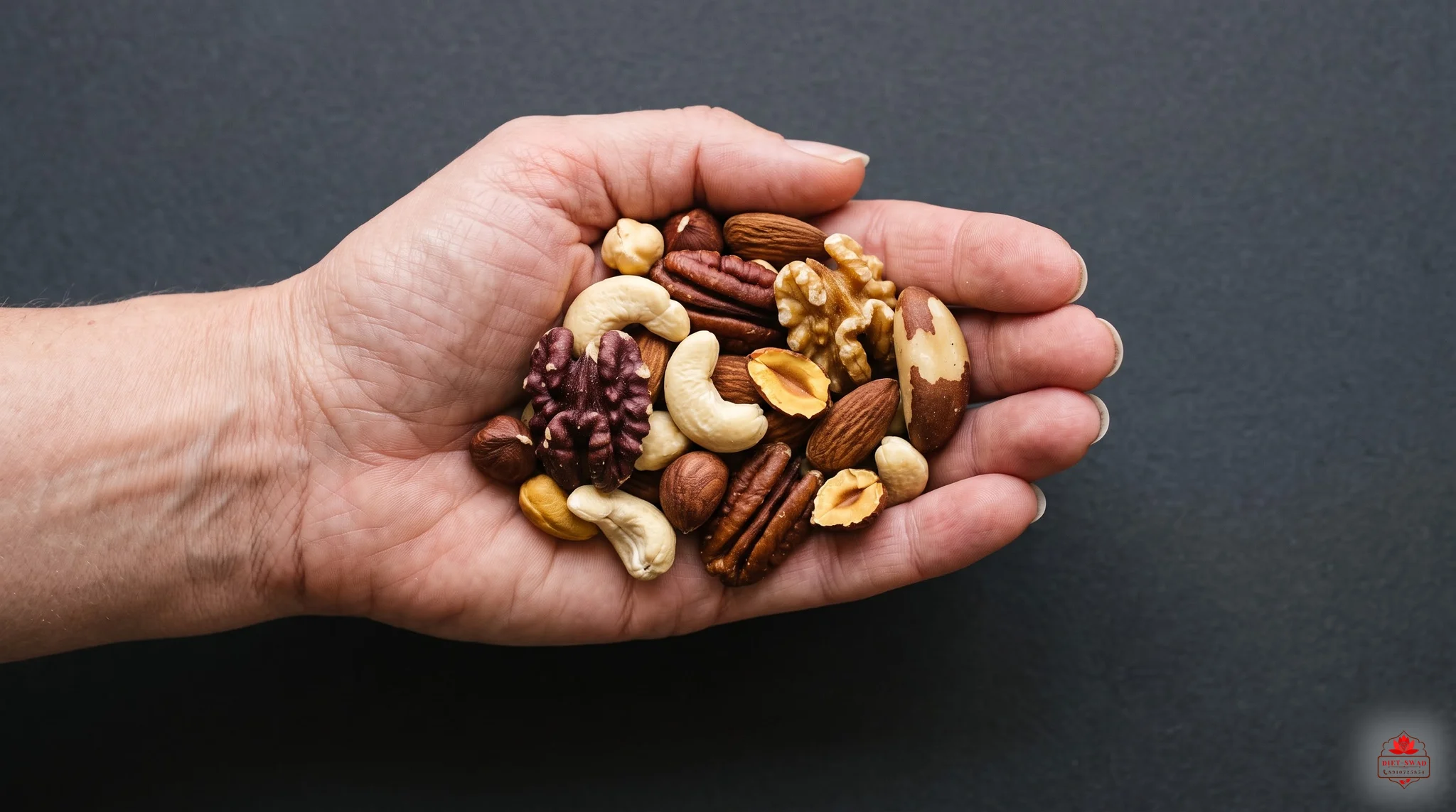 An open palm holding a small portion of mixed nuts against a dark background