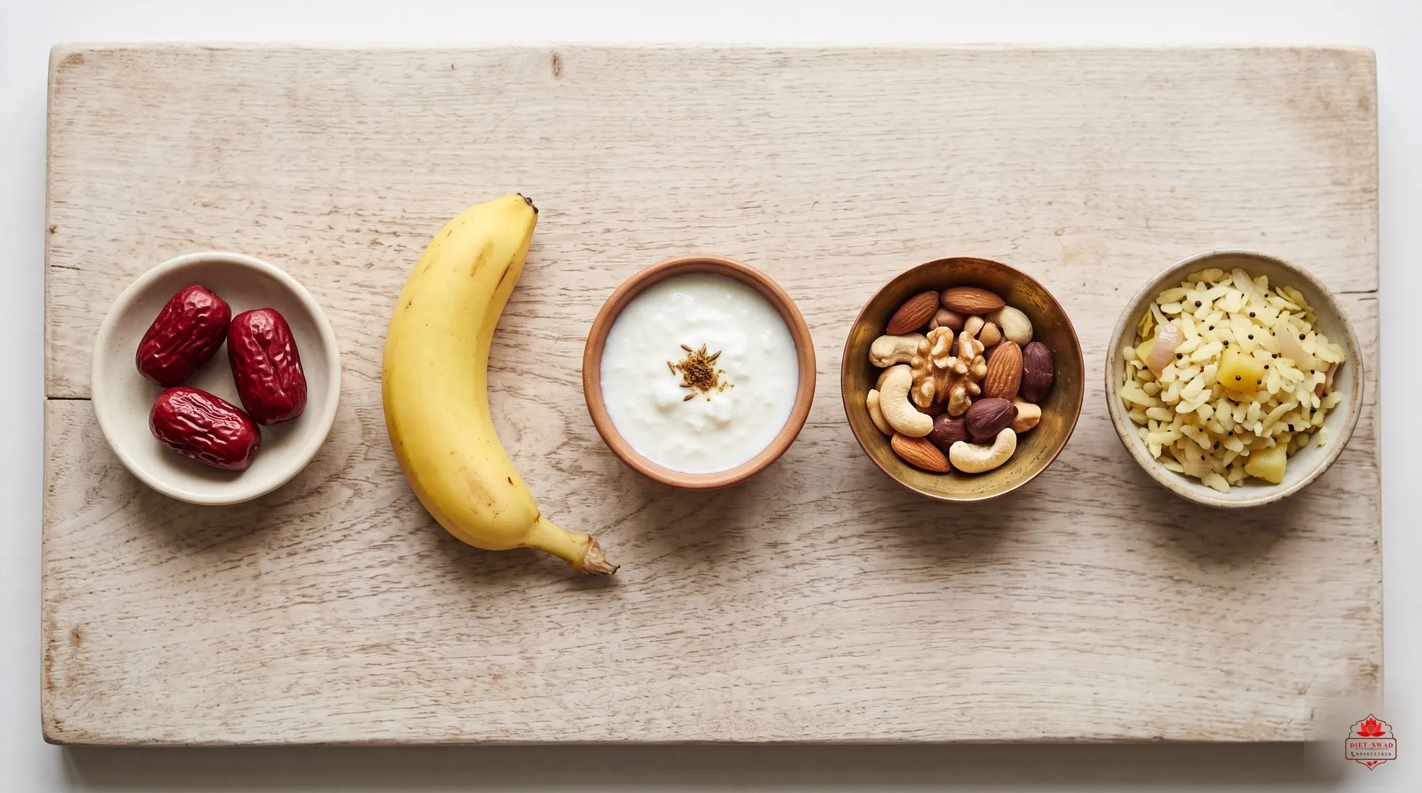 A wooden board of pre-workout foods: dates, banana, curd, nuts and poha
